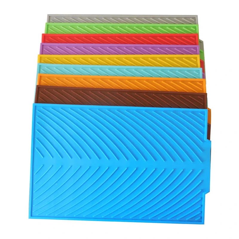 "Silicone Drain Pad Rack - Durable Kitchen Mat for Drying and Protection"